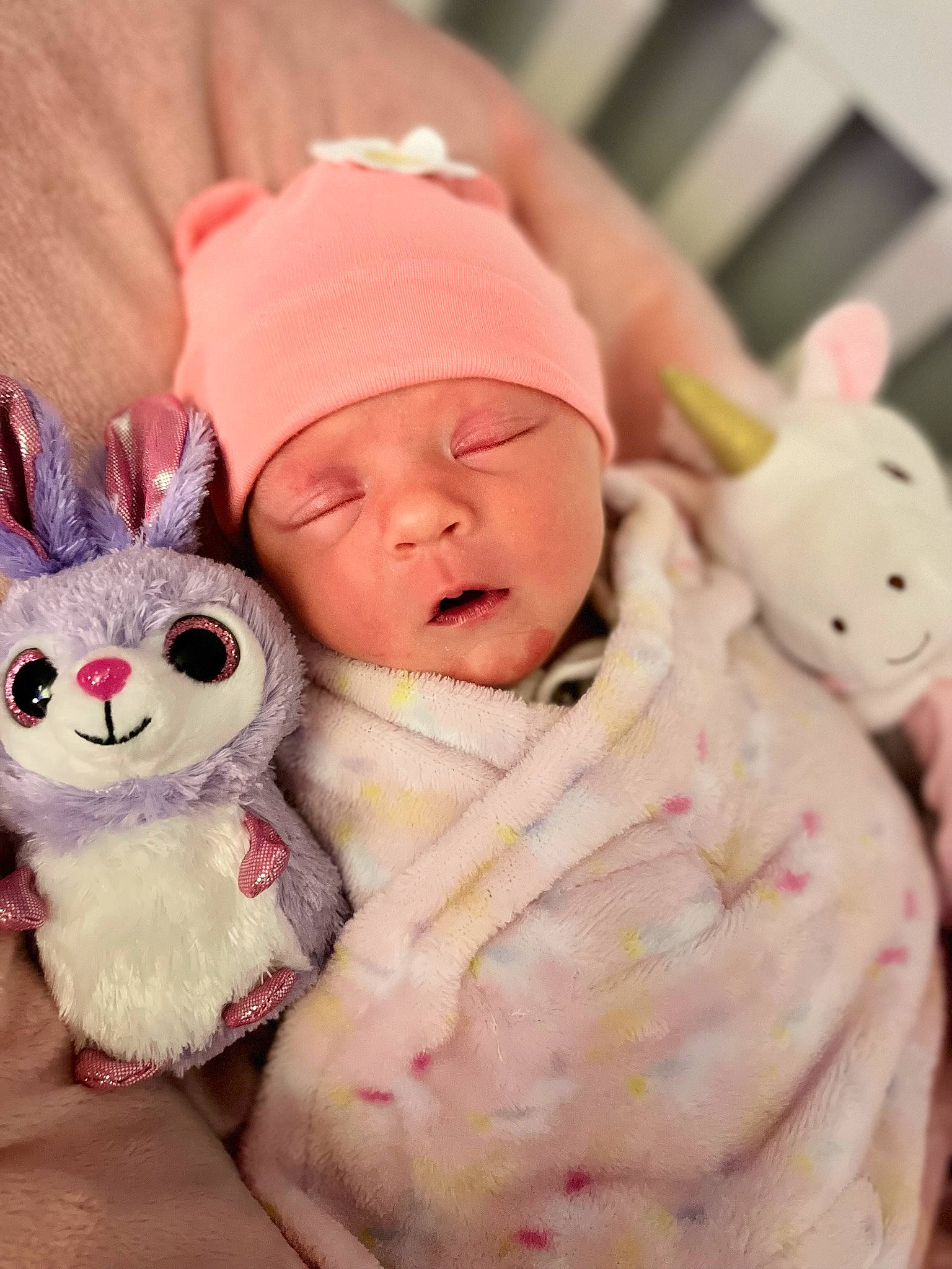 Lorelei is registered to the contest to win money with this photo: baby, baby_sleeping, baby_toddler_clothing, cap, cheek, child, comfort, fur, happy, hat, headwear, linens, mammal, peach, person, pink, skin, stuffed_toy, textile, toddler