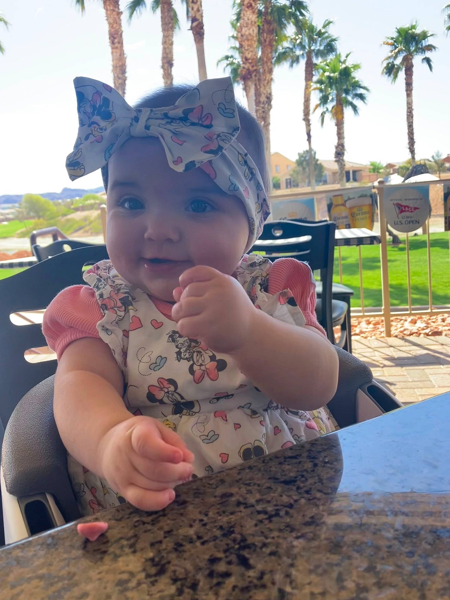 Marley is registered to the contest to win money with this photo: baby, baby_toddler_clothing, fun, grass, happy, hat, head, headwear, human_body, leaf, leisure, person, plant, public_space, recreation, sitting, skin, sky, smile, sunlight