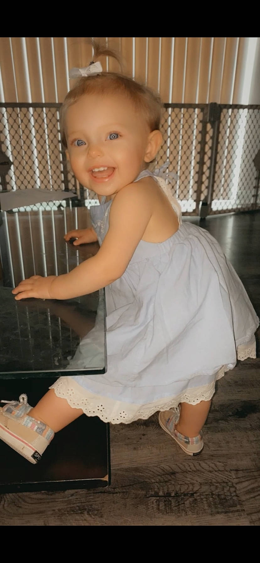 Violette is registered to the contest to win money with this photo: baby, baby_toddler_clothing, child, dress, face, flash_photography, flooring, foot, footwear, hairstyle, happy, human_leg, joint, joy, knee, leg, person, sandal, smile, standing