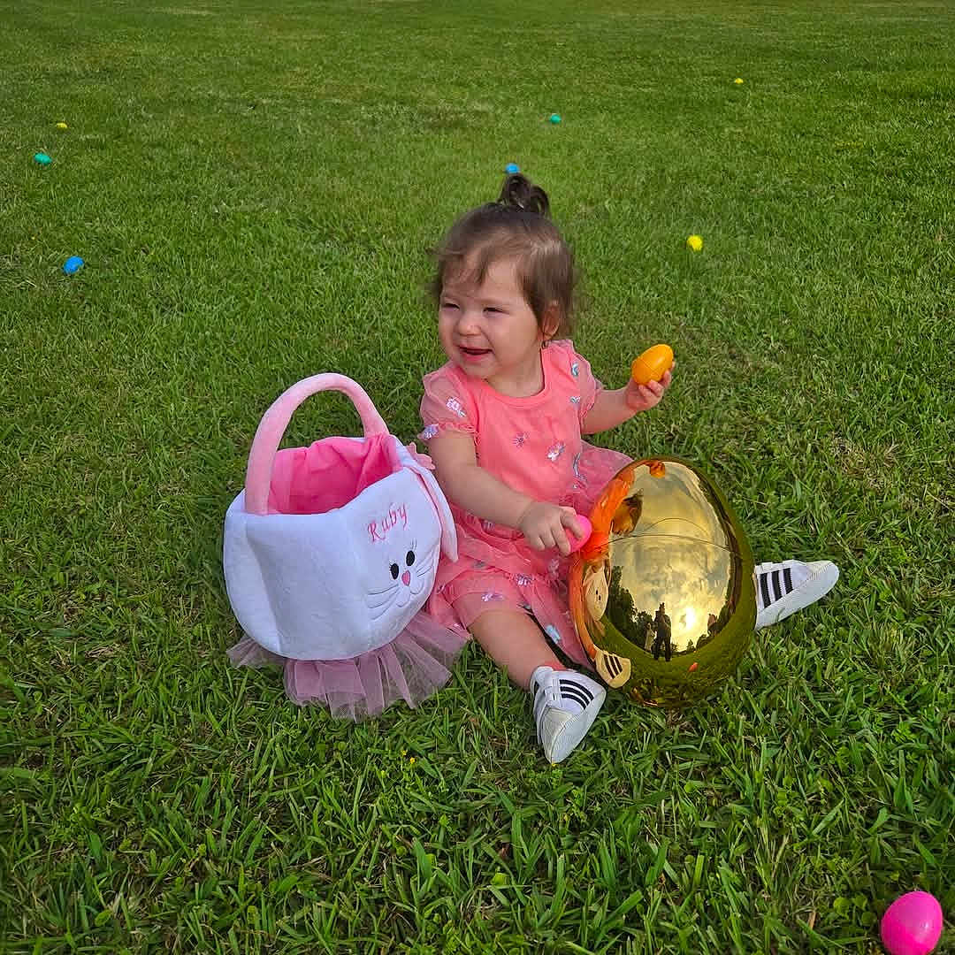 Ruby is registered to the contest to win money with this photo: ball, child, face, female, football, girl, grass, head, lawn, nature, outdoors, park, person, photography, plant, portrait, soccer, soccerball, sphere, sport