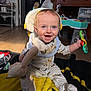 Jensen joined the competition — help win amazing prizes! baby, infant, child, smiling, blue_eyes, onesie, toy, rattle, stuffed_toy, playmat, blanket, wood_floor, dresser, living_room, portrait, cute, sitting, happy, indoor, photography