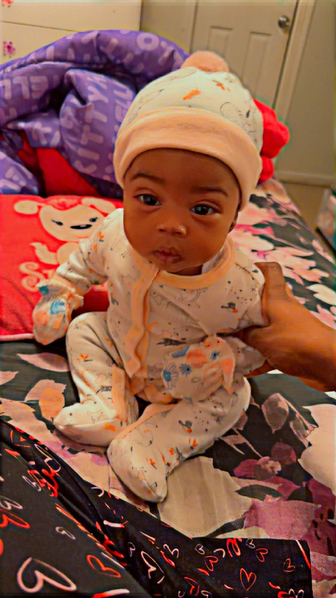 Anarii is registered to the contest to win money with this photo: baby, baby_toddler_clothing, cap, carmine, cheek, child, comfort, event, flooring, fun, happy, leisure, linens, person, pink, play, room, sitting, skin, textile