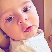 Juliann participe au concours pour gagner de l'argent avec cette photo : baby, child, face, eyes, hair, white_shirt, close_up, infant, portrait, cute, skin, expression, looking, young, indoors, soft_light, curious, person, head, human