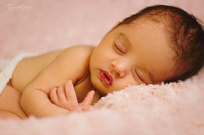 Carolyn is registered to the contest to win money with this photo: bedtime, cheek, child, close_up, infant, lip, person, skin, sleep