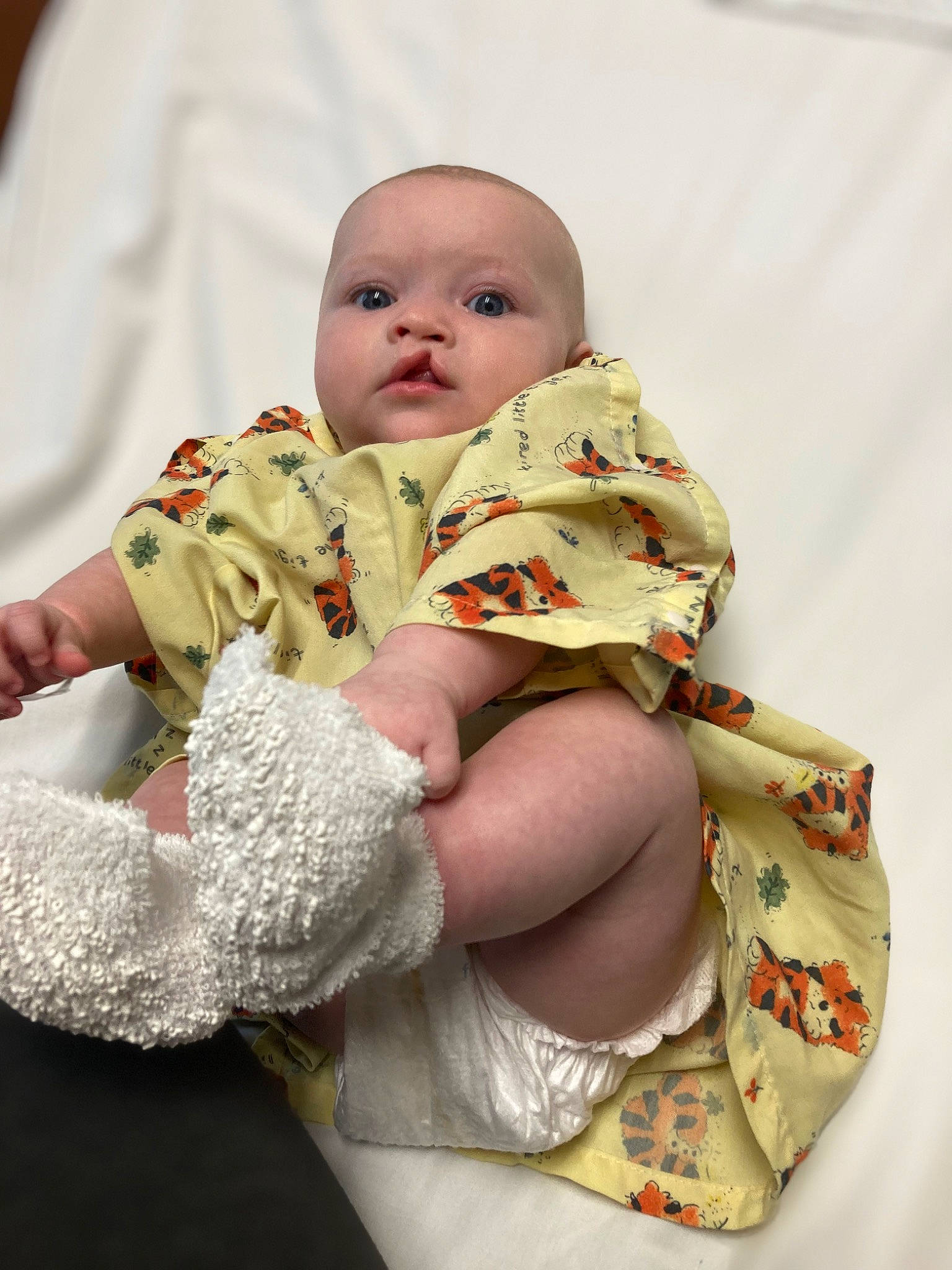 Pheobe is registered to the contest to win money with this photo: baby, baby_products, baby_sleeping, baby_toddler_clothing, cheek, child, comfort, eye, finger, gesture, happy, human_body, linens, person, product, sitting, skin, sleeve, textile, thigh