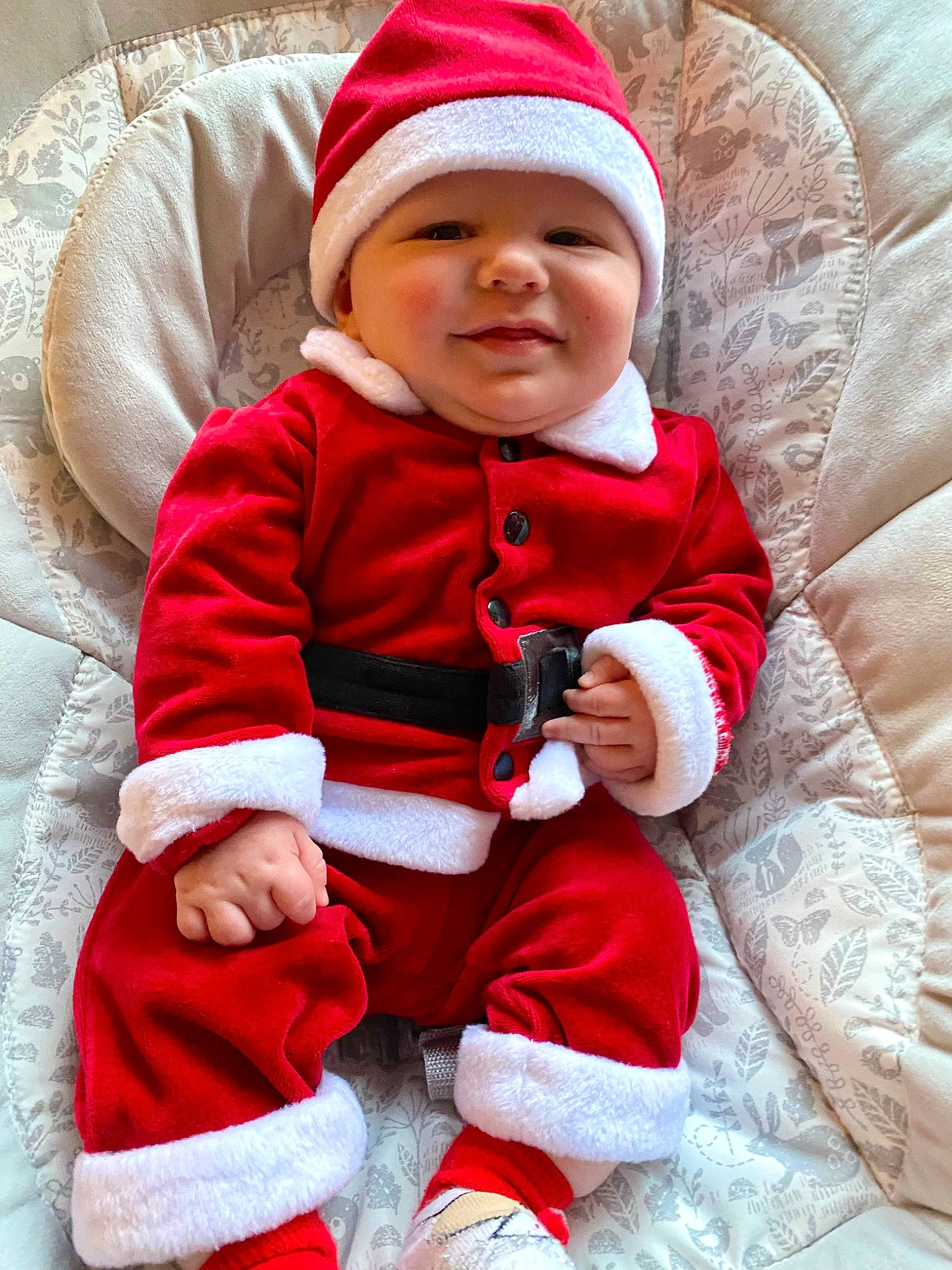 Julian is registered to the contest to win money with this photo: baby, baby_toddler_clothing, cap, cheek, child, clothing, comfort, eye, happy, head, headwear, human_body, jacket, outerwear, person, red, skin, sleeve, smile, textile