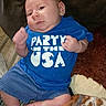 baby, blanket, blue_shirt, casual, child, clothing, comfortable, cozy, cute, denim_shorts, expression, face, fist, indoors, infant, legs, party_shirt, person, sitting, young