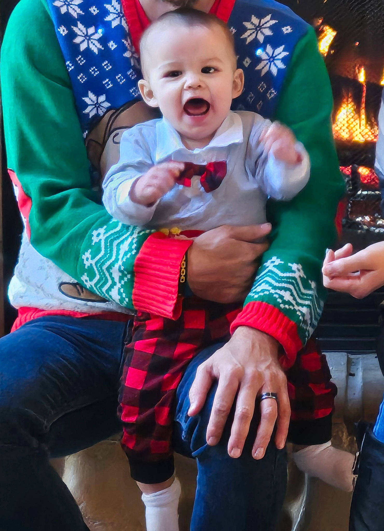Marcus is registered to the contest to win money with this photo: baby, baby_toddler_clothing, blue, child, clothing, event, fun, hand, happy, hat, holiday, lap, people, person, plaid, red, sitting, smile, sock, thigh