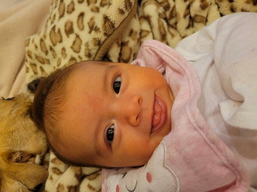 Davina is registered to the contest to win money with this photo: baby, baby_toddler_clothing, cheek, comfort, eye, eyebrow, eyelash, face, fawn, hair, happy, head, iris, lip, mouth, nose, person, skin, smile, toddler