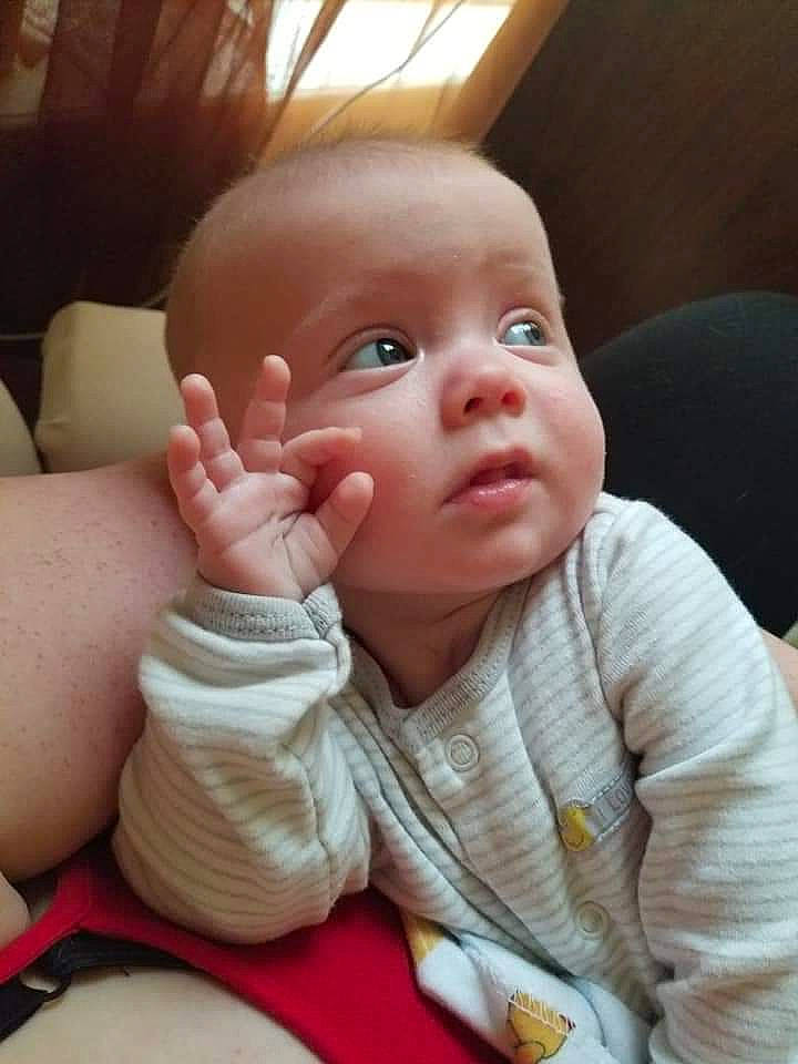 Thatcher is registered to the contest to win money with this photo: baby, cheek, child, chin, ear, eye, face, finger, forehead, gesture, hand, head, lip, mouth, nose, person, skin, thumb, toddler