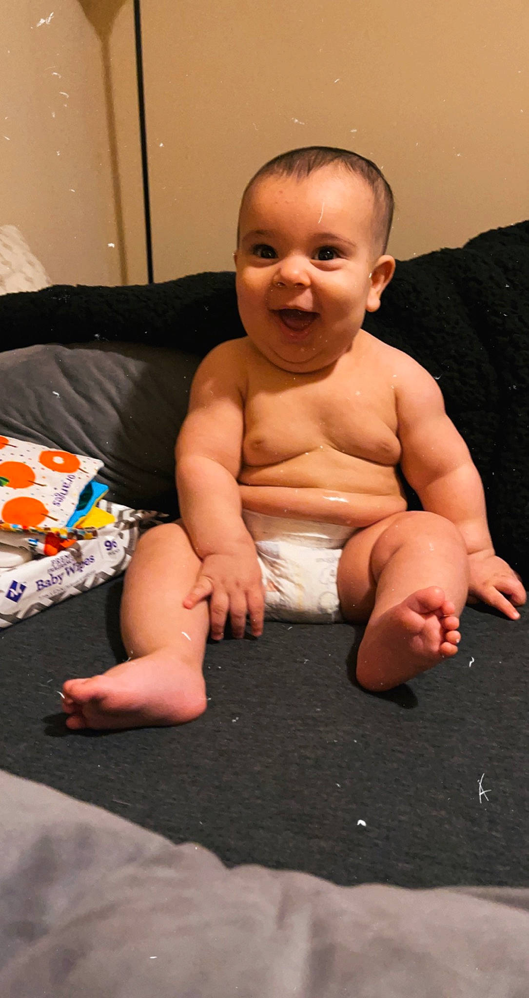 Isaias is registered to the contest to win money with this photo: abdomen, baby, baby_toddler_clothing, barechested, barefoot, cheek, chest, child, finger, foot, mouth, muscle, person, sitting, skin, sole, stomach, thumb, toddler, toe