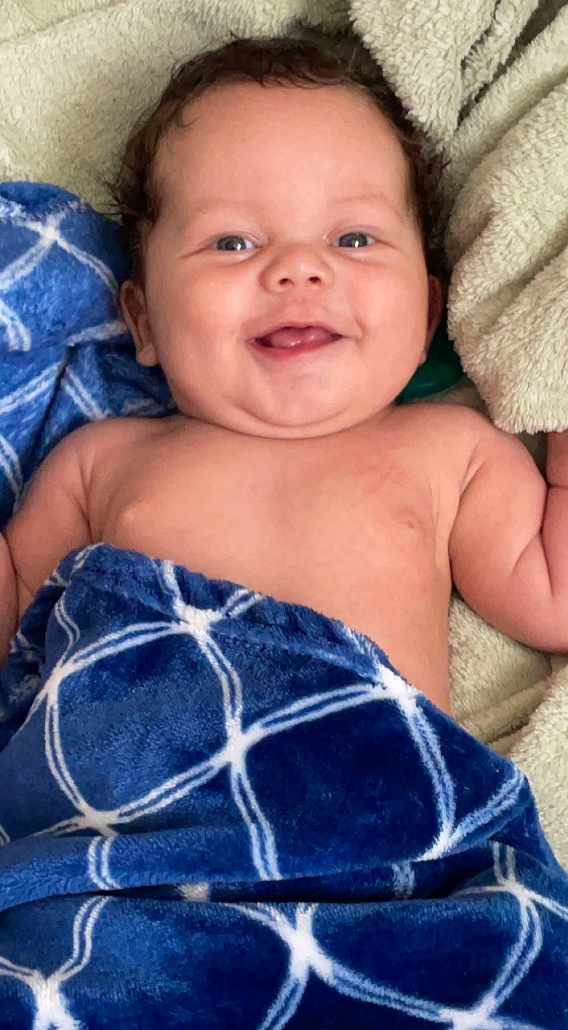 Emir is registered to the contest to win money with this photo: arm, azure, baby_toddler_clothing, blue, cheek, eye, finger, flash_photography, hand, happy, head, human_body, iris, lip, muscle, person, shoulder, skin, smile, textile