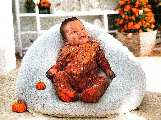 Emir joined the competition — help win amazing prizes! baby, baby_toddler_clothing, carmine, child, comfort, facial_expression, flooring, fur, happy, linens, orange, people, person, plant, pumpkin, red, room, sitting, textile, toddler
