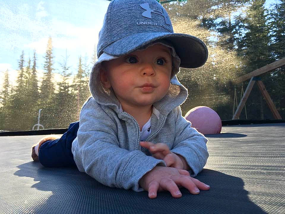 Lucius joined the competition — help win amazing prizes! cheek, child, cool, finger, hand, hat, headgear, headwear, leg, nose, outerwear, person, photography, play, sitting, skin, smile, sun_hat, toddler, tree