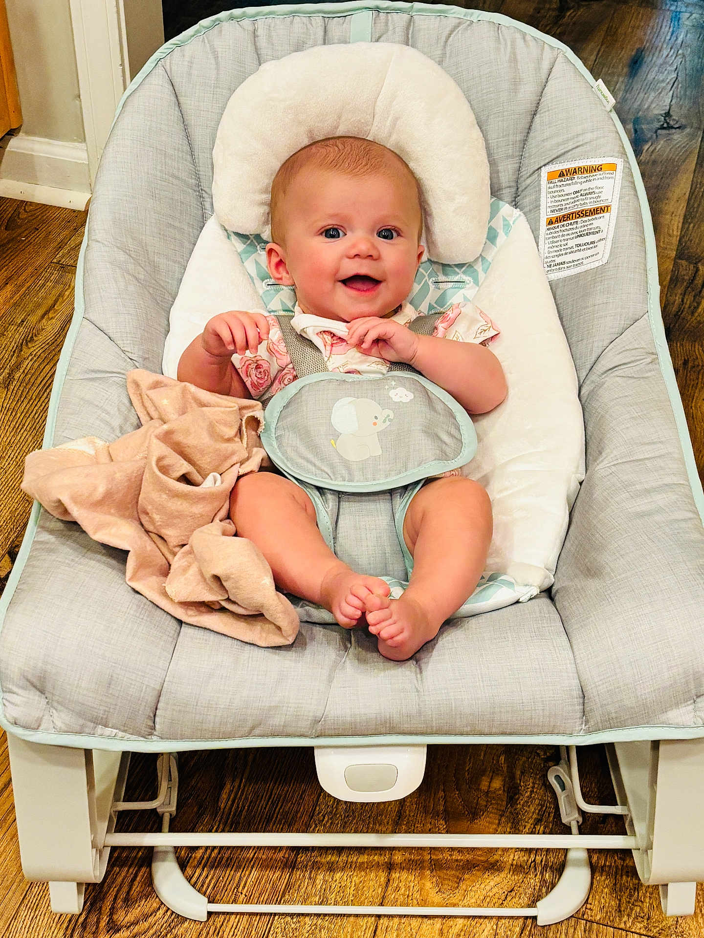 Collins joined the competition — help win amazing prizes! baby, smiling, baby_rocker, blanket, cushion, wooden_floor, infant, happy, clothing, face, feet, person, indoor, seat, head, comfort, cute, child, sitting, expression