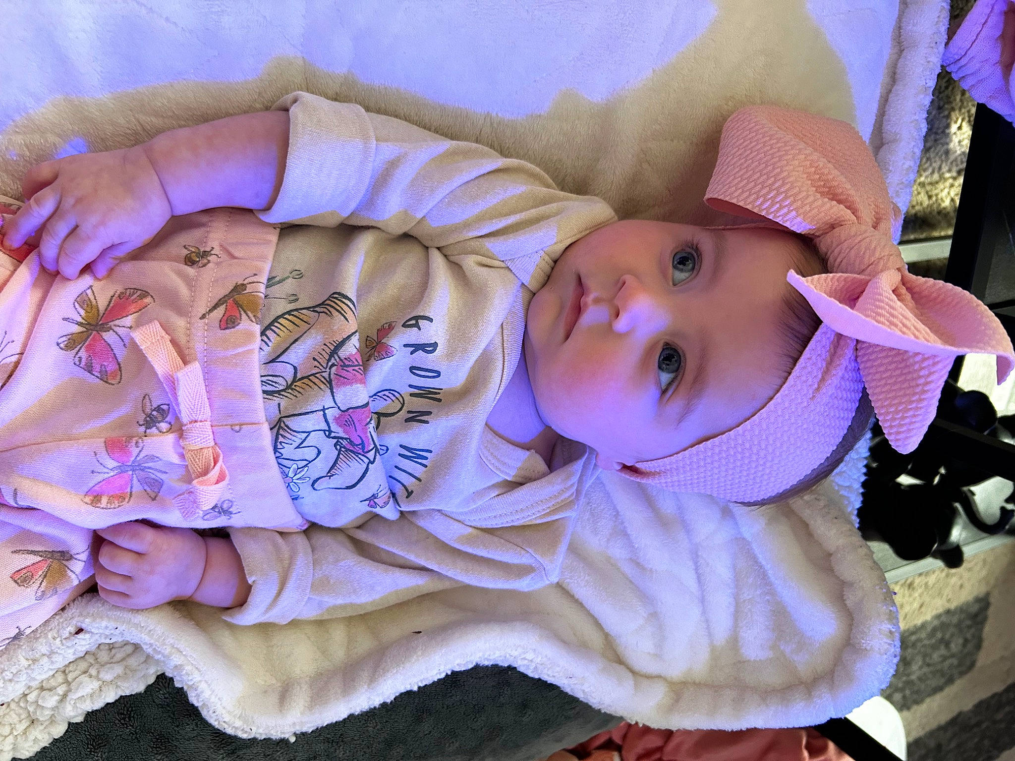 Farren is registered to the contest to win money with this photo: baby, baby_products, baby_toddler_clothing, cheek, child, comfort, eye, fashion_accessory, fur, hat, headgear, headwear, human_body, linens, person, pink, plant, purple, skin, smile