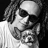 Nouchka participe au concours pour gagner de l'argent avec cette photo : woman, dog, black_and_white, portrait, smiling, sunglasses, headband, curly_hair, happy, pet, tongue_out, closeup, studio, friendly, casual_clothing, earrings, cute, animal, tshirt, face