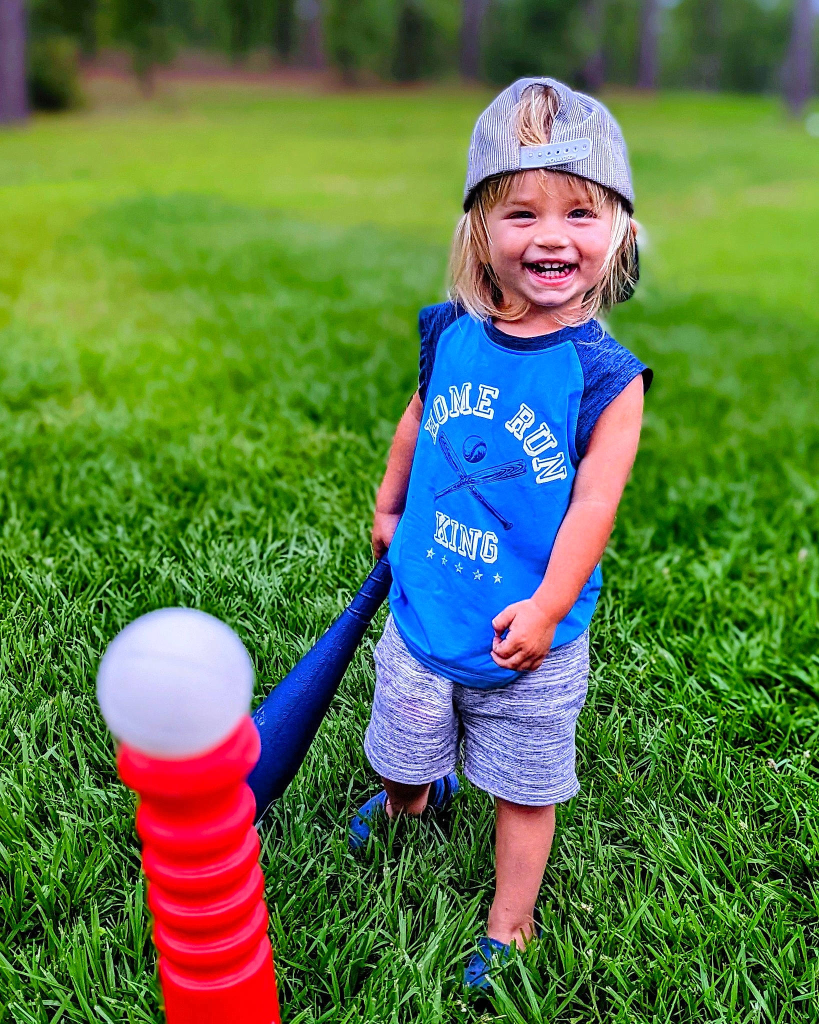 Tate is registered to the contest to win money with this photo: baby_toddler_clothing, child, electric_blue, fun, grass, grass_family, grassland, green, happy, hat, headwear, joy, lawn, leisure, meadow, nature, people_in_nature, person, photograph, plant