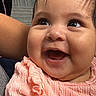 Yessiah Michelle joined the competition — help win amazing prizes! baby, smiling, child, face, headband, flower, clothing, peach, ruffles, indoor, person, happy, closeup, cute, infant, skin, cheeks, eyes, portrait, joy