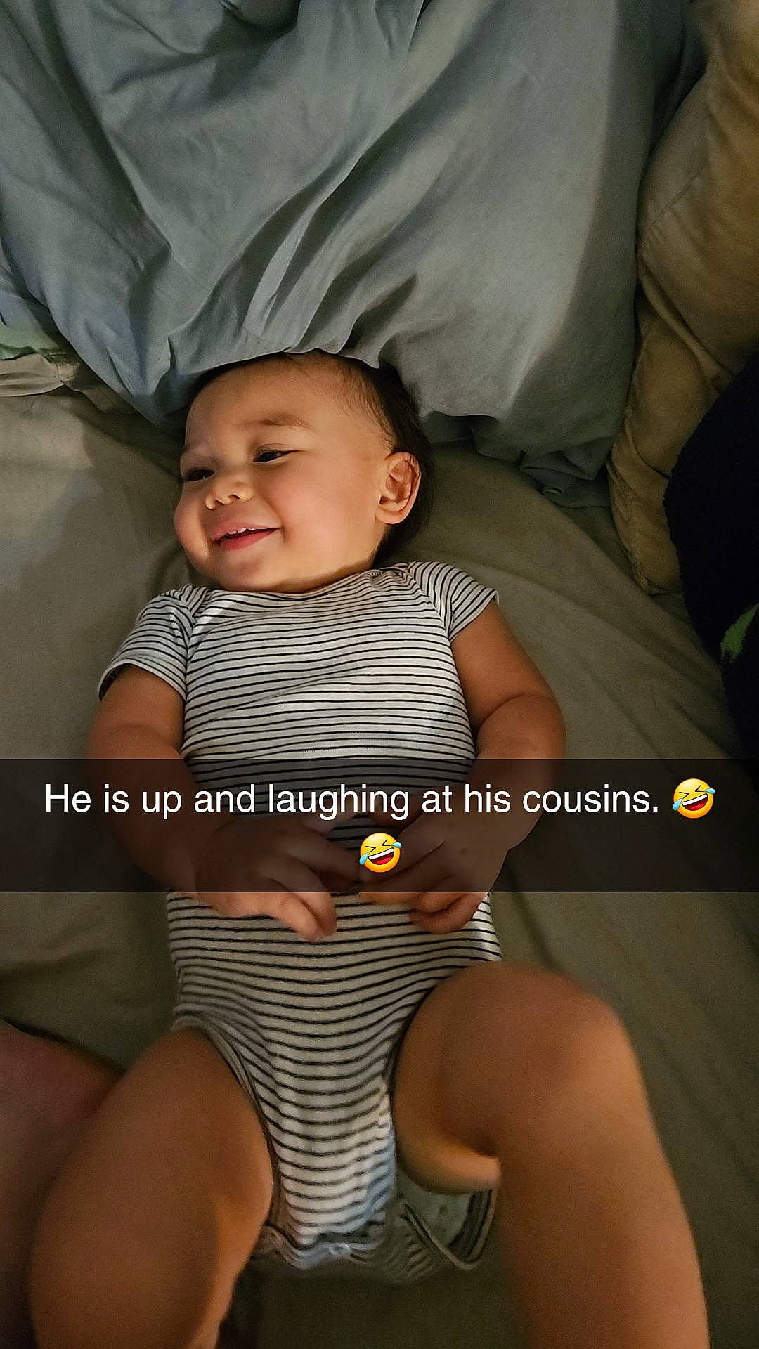 Connor is registered to the contest to win money with this photo: baby, baby_toddler_clothing, child, comfort, couch, eye, facial_expression, finger, flash_photography, happy, human_leg, knee, leg, nail, person, skin, smile, thigh, thumb, toddler