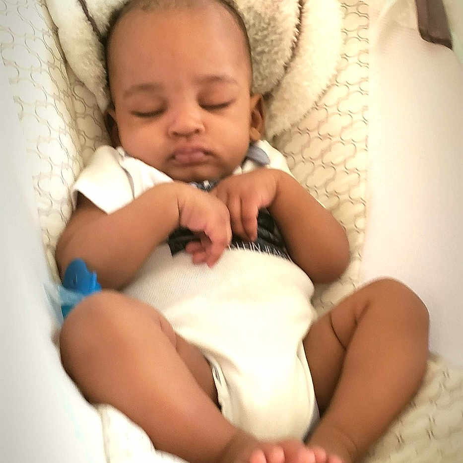 Ja'Tae joined the competition — help win amazing prizes! baby, baby_bed, bassinet, blanket, close_up, cozy, feet, hands, head, indoor, infant, nap, newborn, onesie, pacifier, peaceful, pillow, plush_toy, portrait, sleeping