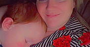 Cain is registered to the contest to win money with this photo: affection, casual, child, close_up, comfort, cute, emojis, face, heart, indoor, love, person, portrait, red_roses, resting, rose, sleeping, smiling, striped_shirt, woman