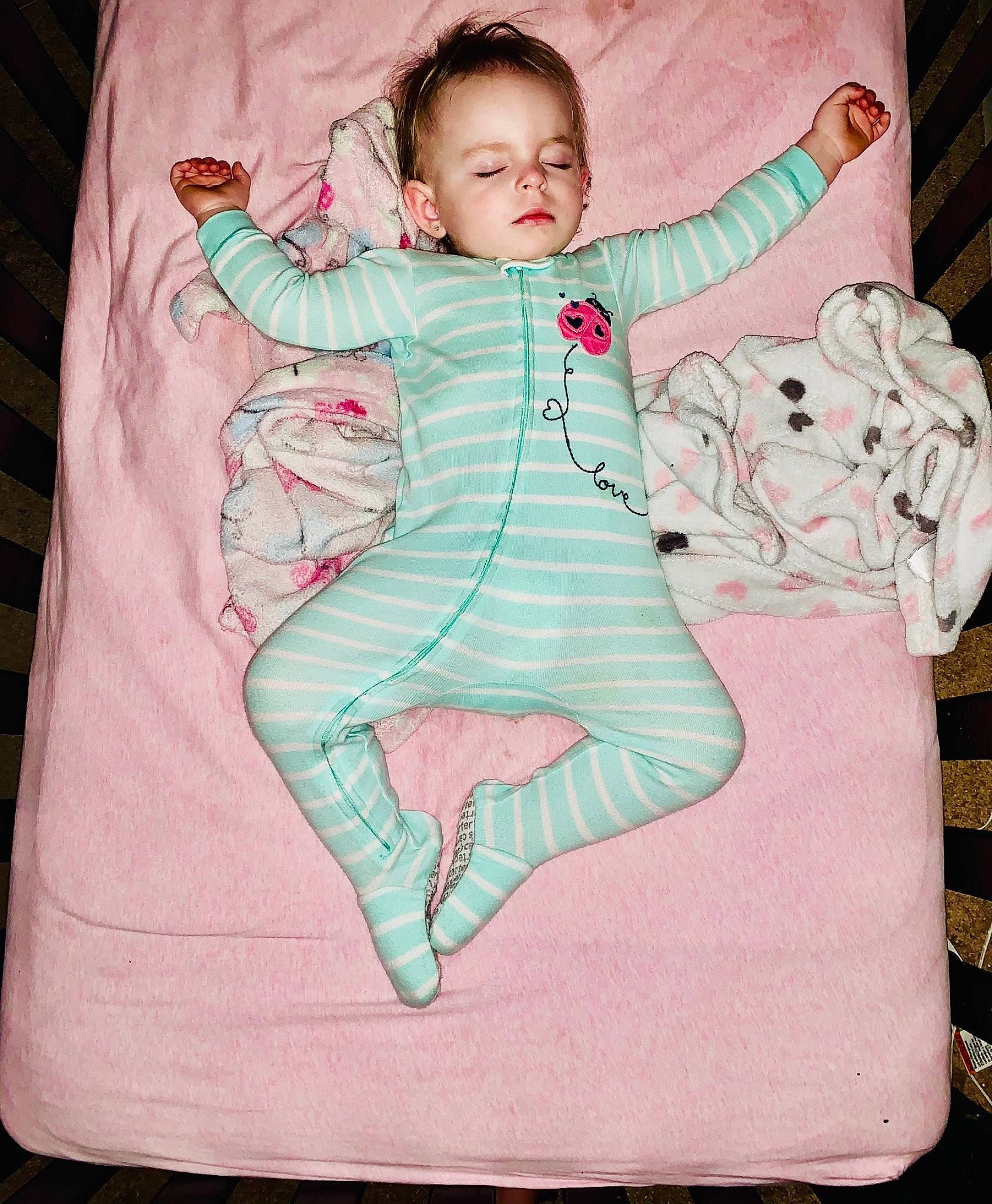 Blakely is registered to the contest to win money with this photo: abdomen, baby, baby_products, baby_toddler_clothing, barefoot, child, comfort, face, gesture, happy, human_body, leg, linens, magenta, outerwear, pattern, person, pink, sitting, sleeve