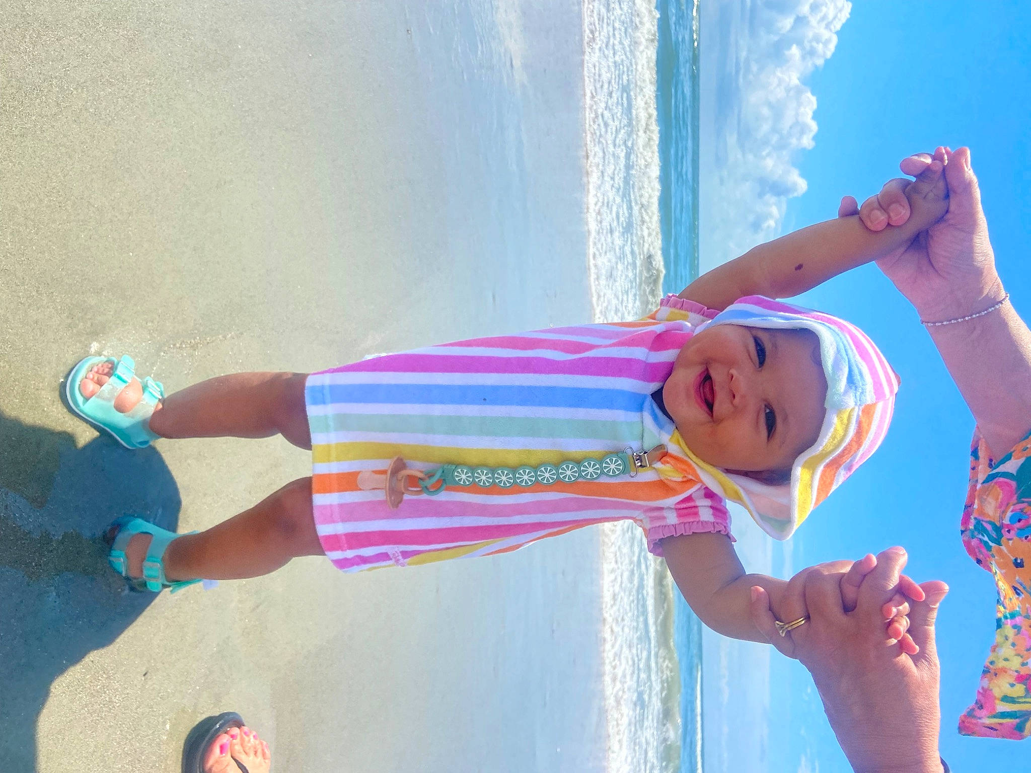Emmie joined the competition — help win amazing prizes! azure, beach, blue, body_of_water, cloud, dress, elbow, electric_blue, fun, gesture, happy, headwear, joy, leisure, light, people_in_nature, people_on_beach, person, photograph, sky