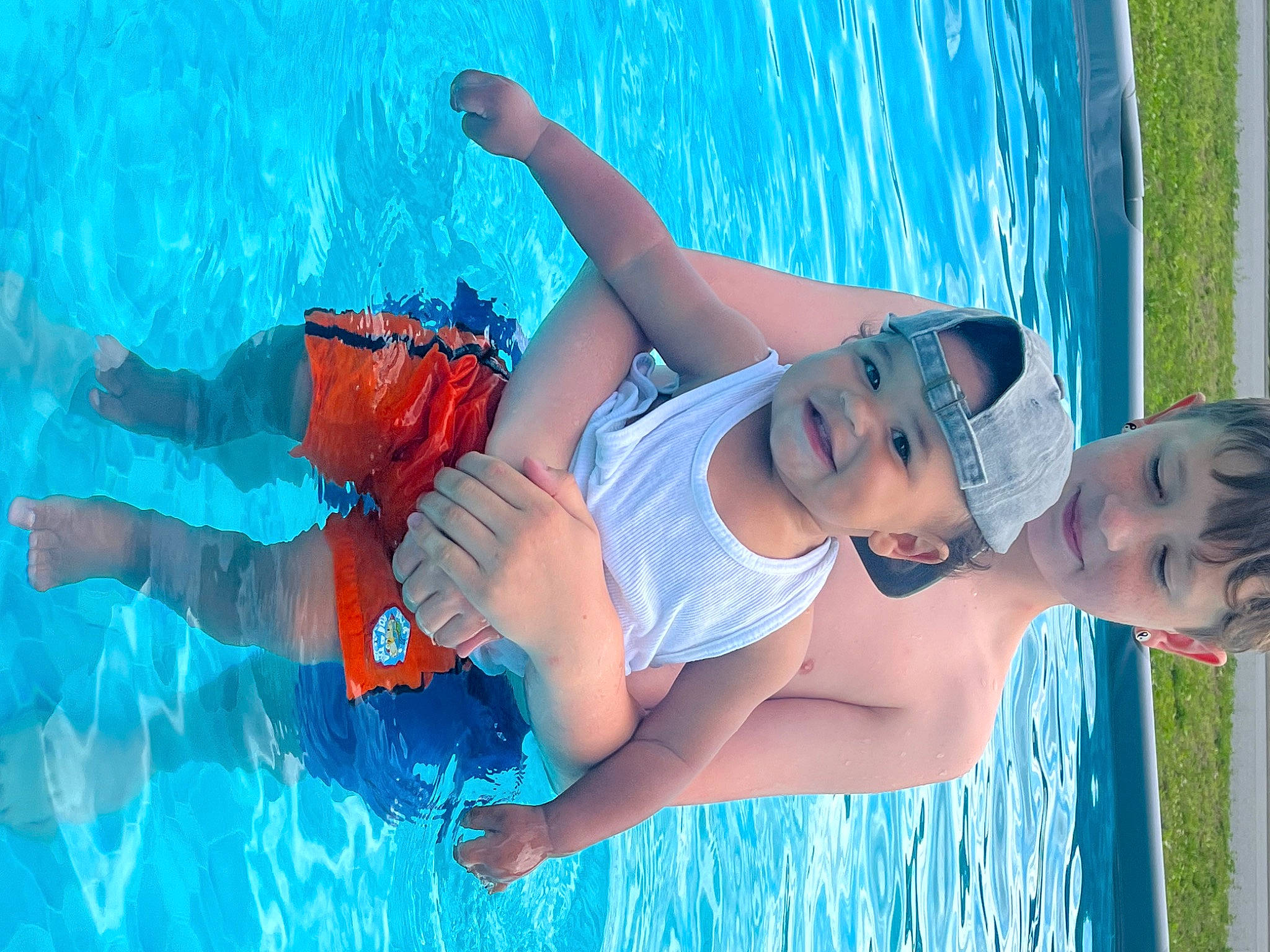 Jett joined the competition — help win amazing prizes! aqua, arm, azure, black_hair, blue, electric_blue, flash_photography, fun, happy, headwear, joy, leisure, muscle, people_in_nature, person, photograph, recreation, red, summer, sunlight