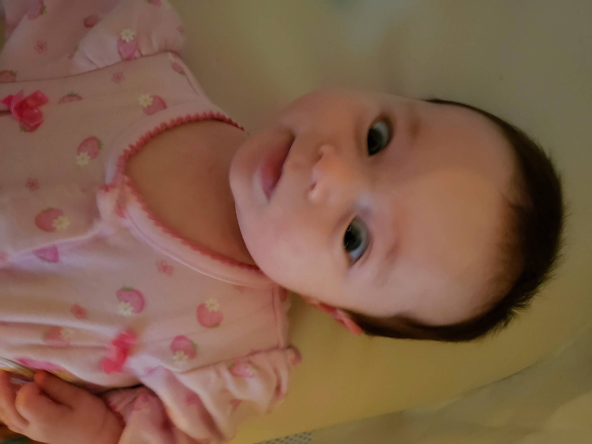 Arabella is registered to the contest to win money with this photo: baby, baby_products, baby_toddler_clothing, cheek, child, comfort, eye, eyelash, happy, iris, lip, nail, nose, pattern, person, room, skin, sleeve, smile, toddler