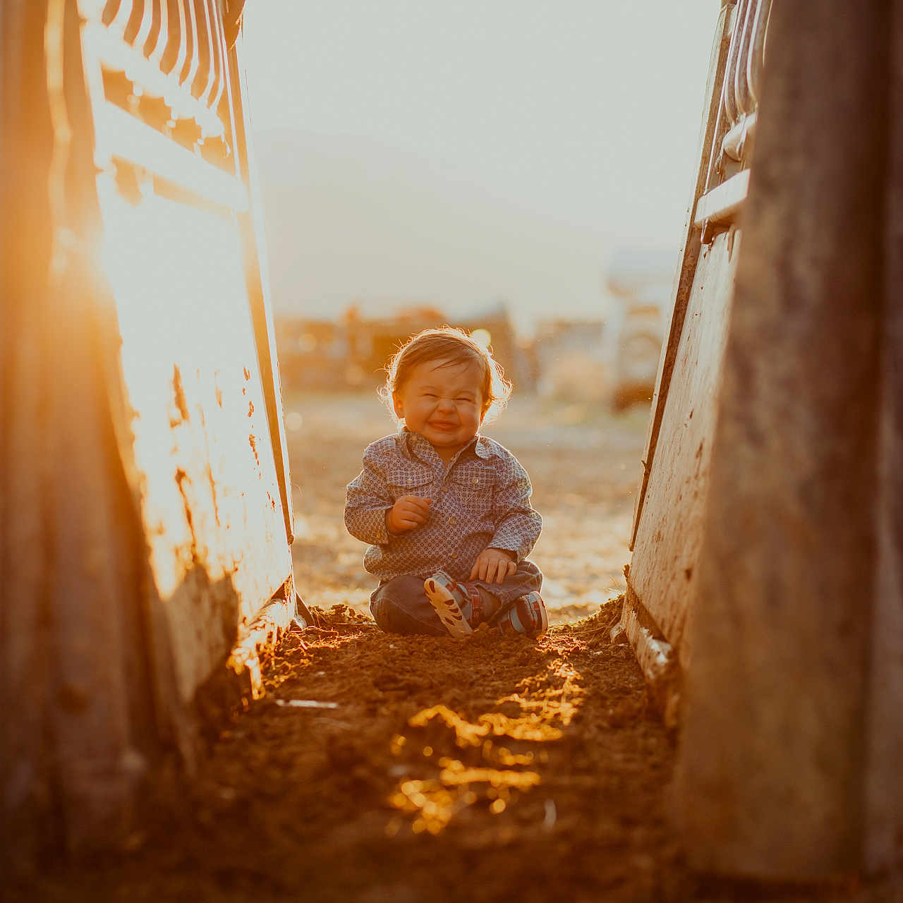 Walker is registered to the contest to win money with this photo: baby, bodypart, city, clothing, crawling, face, finger, hand, happy, head, outdoors, pants, person, photography, portrait, road, sitting, smile, street, urban