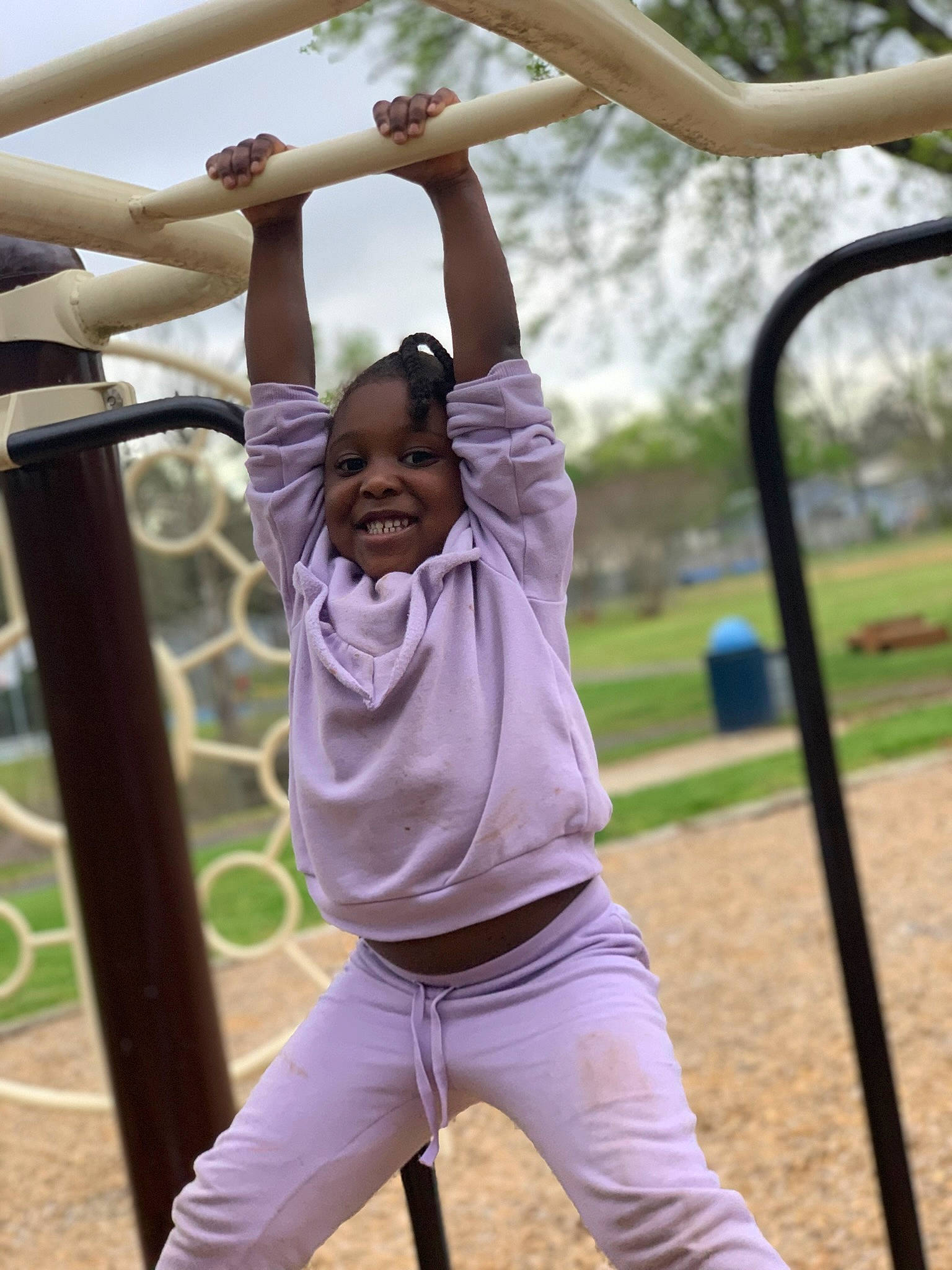 Chosen is registered to the contest to win money with this photo: balance, child, elbow, fun, grass, happy, joy, leisure, light, nature, outdoor_play_equipment, person, photograph, playground, playing_sports, recreation, shorts, sky, smile, swing