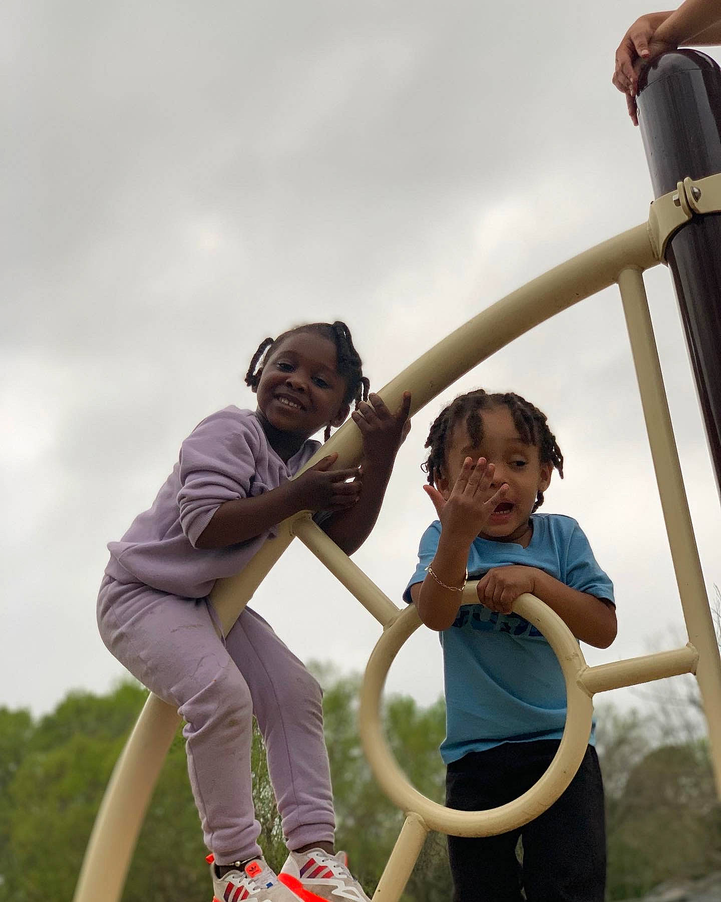 Chosen is registered to the contest to win money with this photo: child, cloud, event, fun, gesture, grass, happy, joy, leisure, outdoor_play_equipment, people_in_nature, person, pole, recreation, shorts, sky, smile, standing, t_shirt, toddler