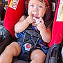 Gracelyn joined the competition — help win amazing prizes! baby, child, car_seat, pacifier, headband, red, blue_eyes, curly_hair, sitting, straps, safety, infant, cute, chubby_legs, clothing, closeup, indoor, person, seat, smiling