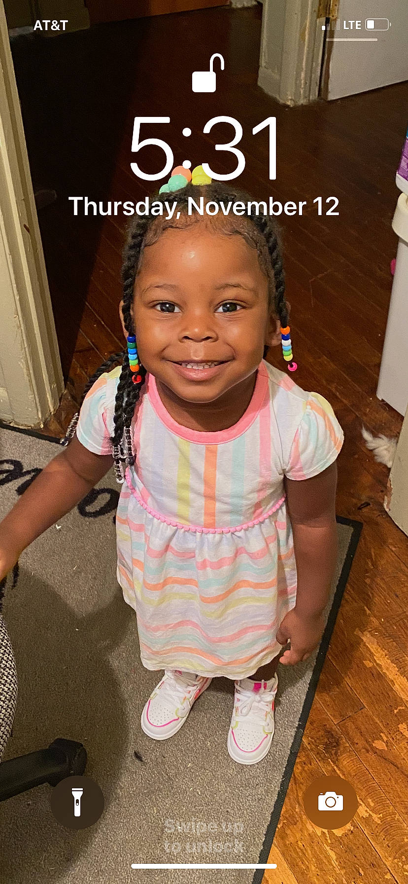 Alauna is registered to the contest to win money with this photo: baby_toddler_clothing, child, clothing, cool, door, face, fun, hairstyle, happy, jewellery, joy, magenta, person, photo_caption, pink, sandal, skin, smile, standing, t_shirt