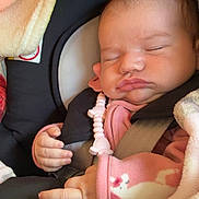 Juliana joined the competition — help win amazing prizes! baby, sleeping, car_seat, pink_clothing, blanket, pacifier_clip, infant, child, cute, peaceful, straps, safety, newborn, face, hand, indoors, portrait, resting, cozy, soft