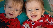 Oliver And Owen joined the competition — help win amazing prizes! children, toddlers, siblings, twins, smiling, happy, portrait, close_up, indoors, playmat, pajamas, red_clothing, blonde_hair, blue_eyes, baby, elephant_toy, stuffed_animal, cuddling, sitting, family