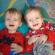 Oliver And Owen is registered to the contest to win money with this photo: toddlers, children, twins, smiling, happy, portrait, indoors, play_mat, pajamas, spiderman, red_clothing, festive_clothing, plush_toy, elephant, toy, sitting, lying_down, siblings, close_up, colorful_background