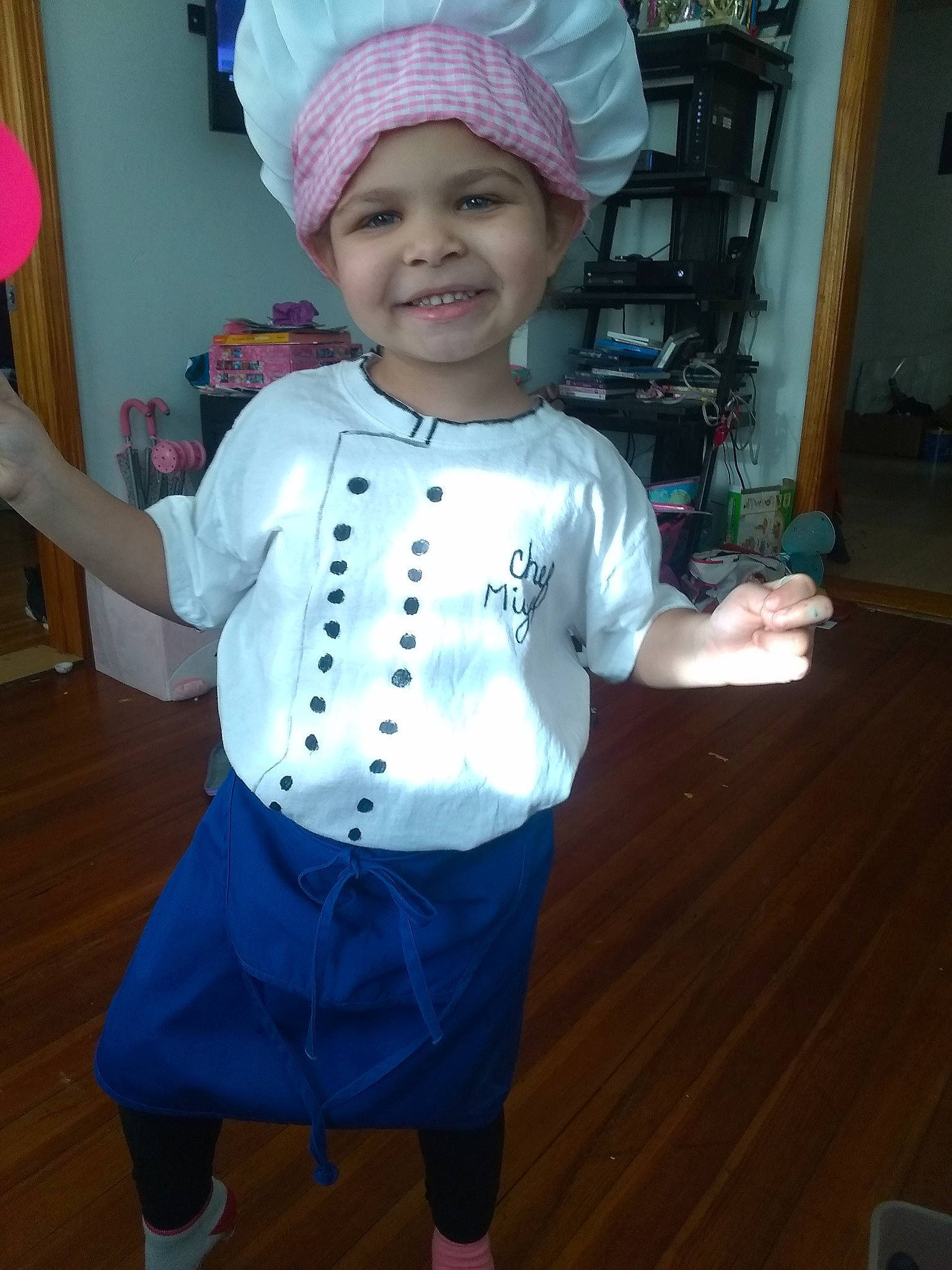 Miyah is registered to the contest to win money with this photo: baby_toddler_clothing, child, clothing, costume, happy, head, headgear, headwear, joy, person, pink, sleeve, smile, t_shirt, toddler, white