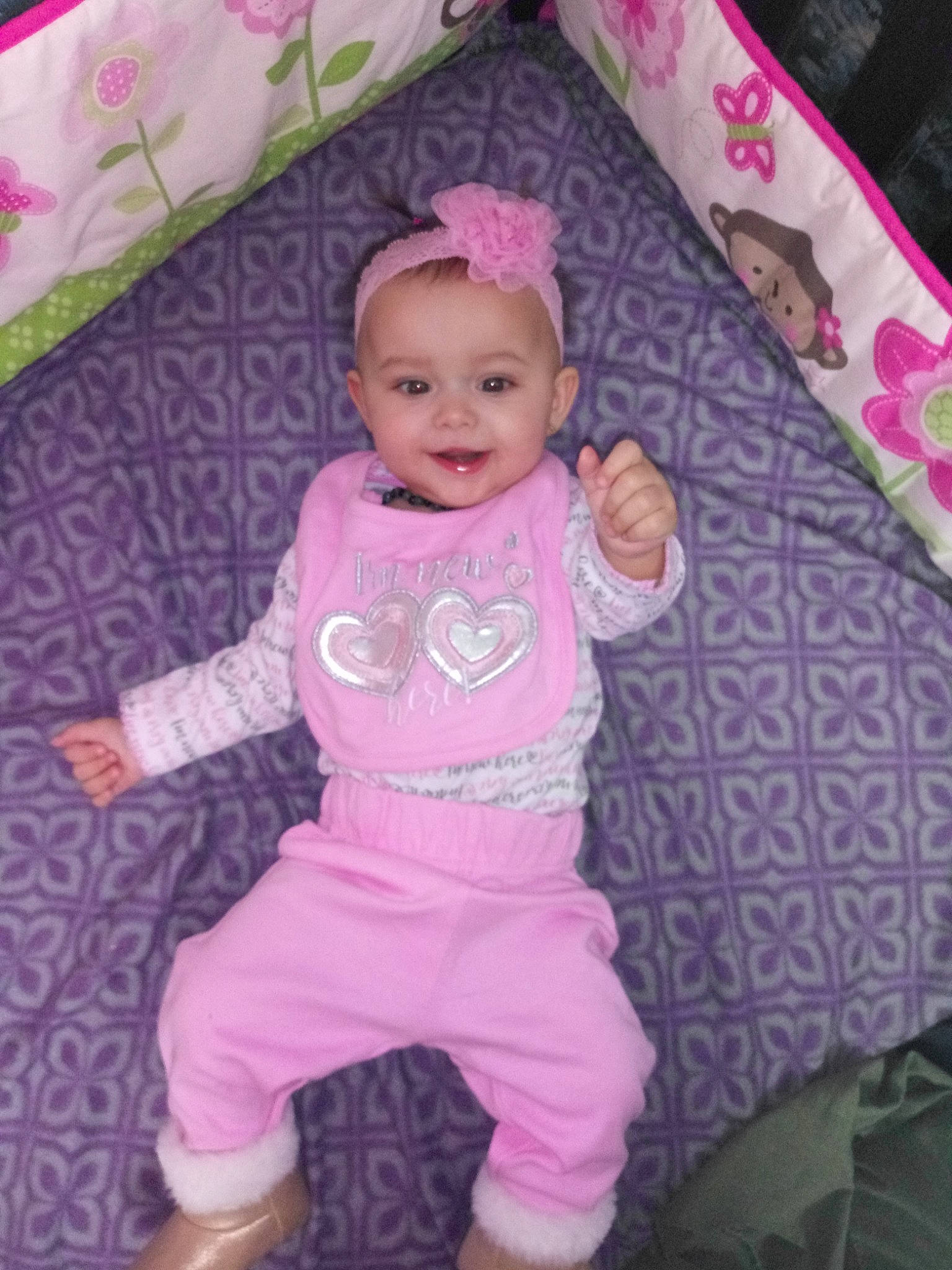 Abbilene is registered to the contest to win money with this photo: baby_products, child, day, fun, girl, hair_accessory, human_hair_color, infant, iris, magenta, person, pink, product, purple, skin, smile, textile, toddler, violet