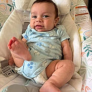 Casin Cole Delawder is registered to the contest to win money with this photo: baby, infant, onesie, foot, tongue, smile, child, cushion, seat, fabric, pattern, indoor, cute, playful, skin, person, resting, happy, head_support, straps