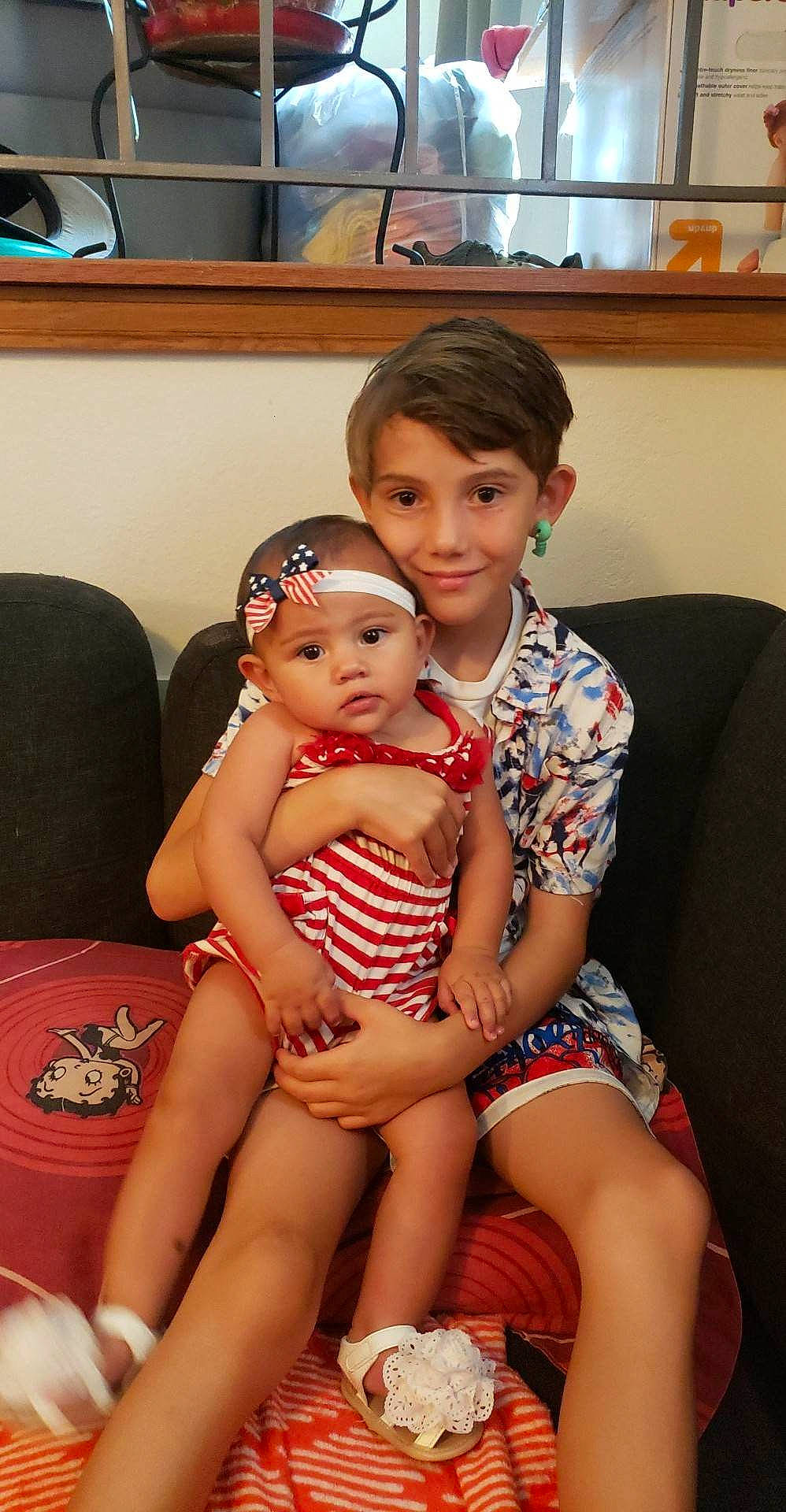 Ava'Rae is registered to the contest to win money with this photo: abdomen, baby, chest, child, comfort, event, flooring, foot, fun, happy, headwear, human_leg, joy, lap, leg, leisure, person, picture_frame, room, sitting