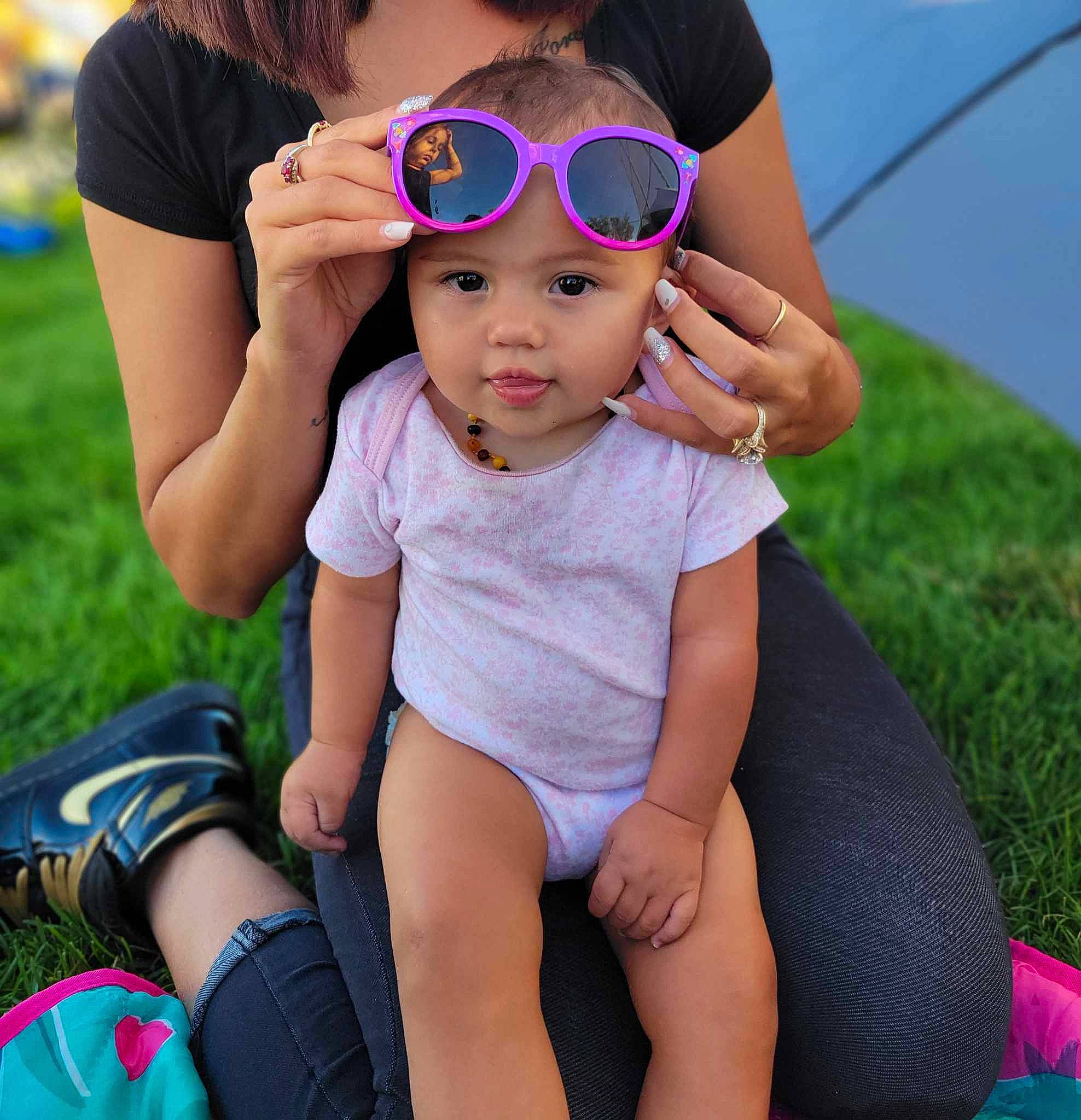 Ava'Rae joined the competition — help win amazing prizes! baby_toddler_clothing, blue, eyewear, face, finger, fun, gesture, goggles, grass, happy, headwear, leisure, people, person, photograph, pink, shorts, skin, summer, thigh