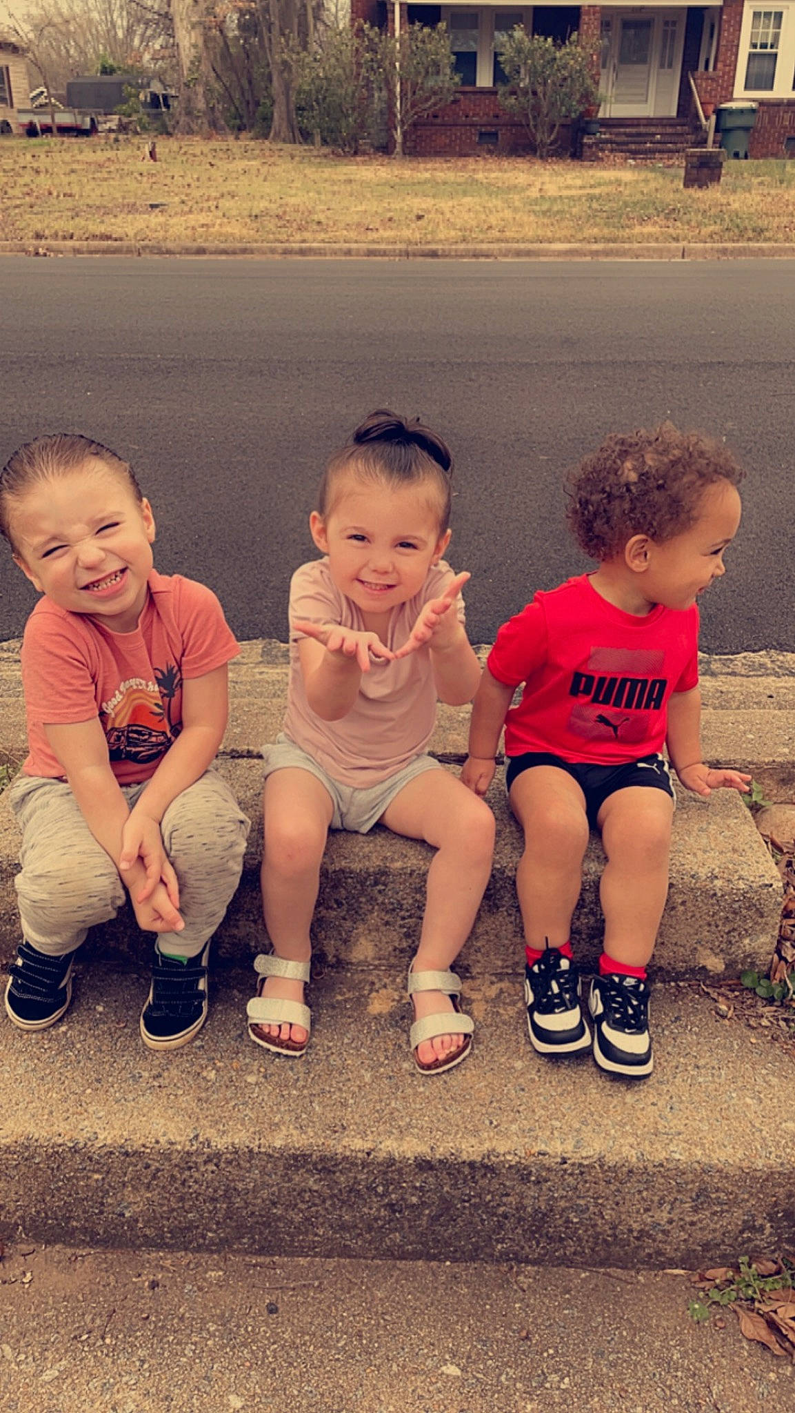 Bailey is registered to the contest to win money with this photo: baby, child, facial_expression, fun, gesture, grass, hairstyle, happy, joy, leg, leisure, people_in_nature, person, recreation, shorts, sitting, skin, smile, standing, summer