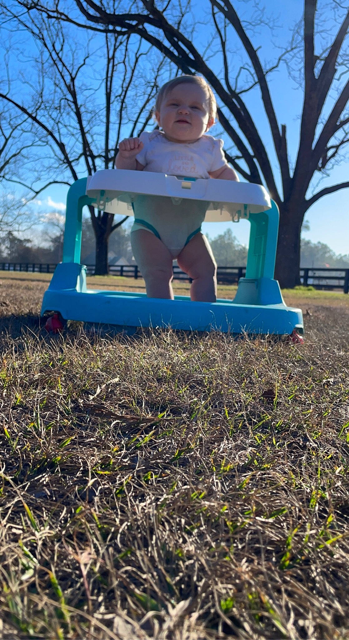 Grace is registered to the contest to win money with this photo: baby, baby_toddler_clothing, child, city, electric_blue, fun, grass, happy, human_leg, leisure, outdoor_play_equipment, people_in_nature, person, plant, recreation, sitting, sky, soil, swing, toddler