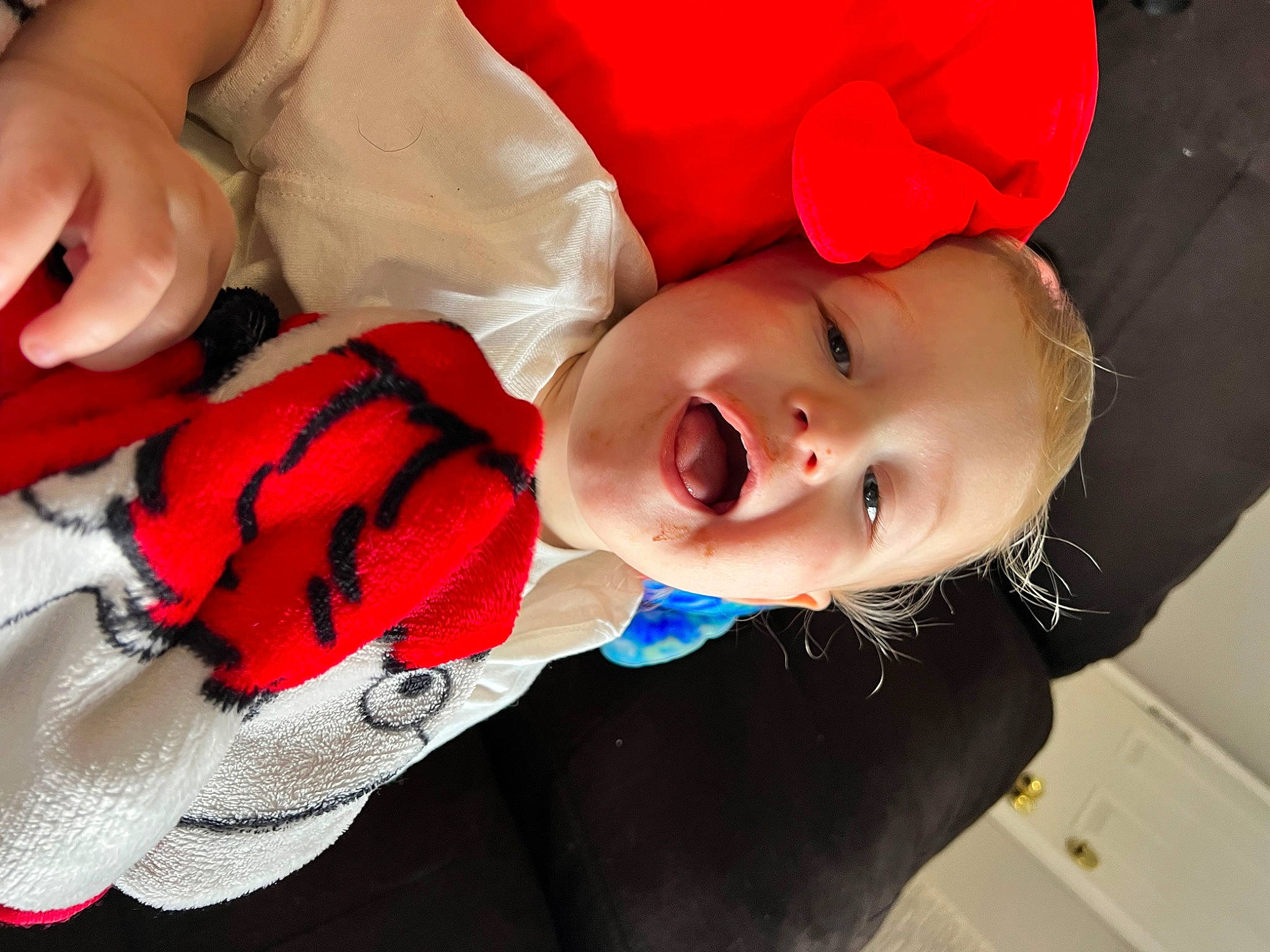 Stanton is registered to the contest to win money with this photo: baby, baby_laughing, baby_toddler_clothing, carmine, cheek, child, comfort, electric_blue, face, fun, happy, hat, lip, nail, pattern, person, red, sleeve, smile, thumb