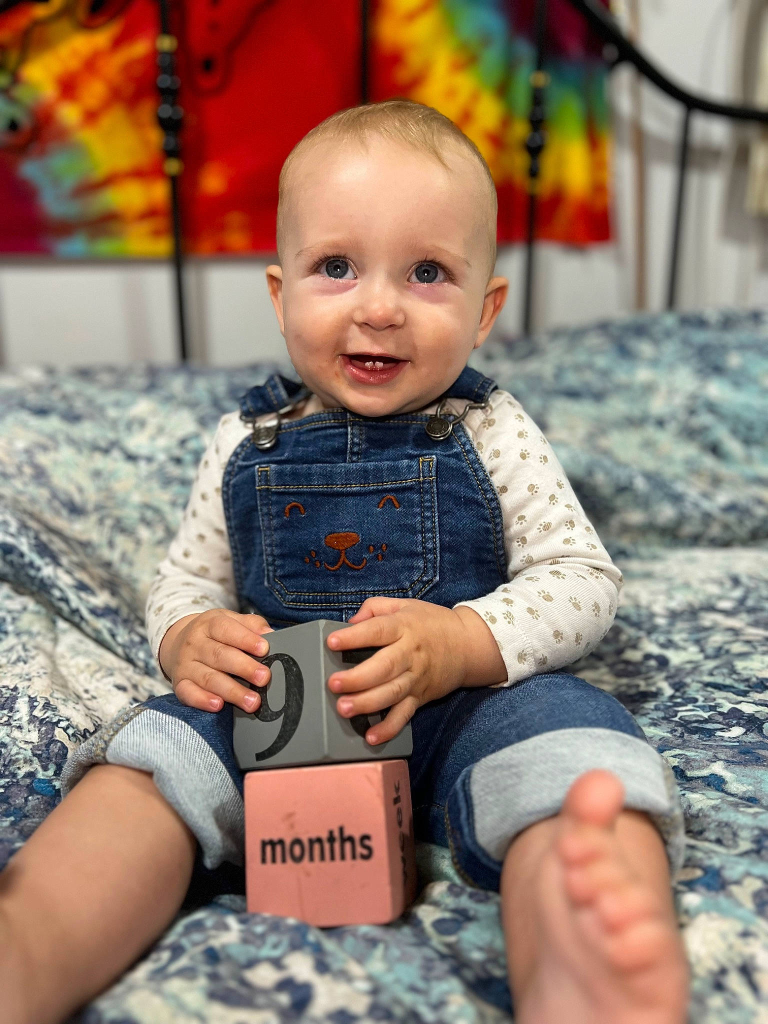 Parker-jordan is registered to the contest to win money with this photo: baby, baby_toddler_clothing, child, finger, foot, fun, gadget, happy, human_leg, joy, leisure, nail, orange, pattern, person, play, sitting, skin, sleeve, smile