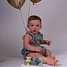 Anthuan is registered to the contest to win money with this photo: baby, birthday_cake, balloons, studio, child, first_birthday, cake, decorations, lion, elephant, giraffe, sitting, cute, party, celebration, blue_eyes, short_hair, outfit, white_background, photography