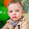 Anthuan joined the competition — help win amazing prizes! toddler, child, portrait, blue_eyes, beige_shirt, scarf, number_one_patch, short_hair, balloons, green_balloon, orange_balloon, indoor, close_up, face, serious_expression, buttoned_shirt, patterned_scarf, person, background, decor