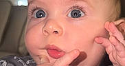 Anthuan is registered to the contest to win money with this photo: adorable, baby, blinds, bracelet, cheeks, child, close_up, clothing, couch, eyelashes, eyes, face, fingers, hand, indoor, infant, onesie, pink_lips, portrait, window